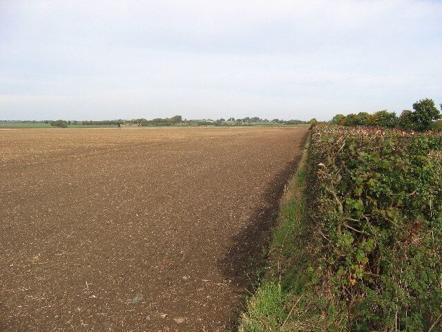 Farmland north of Long Riston, East Riding of Yorkshire, England. This is a good representative view of this grid square. The road from Long Riston in the adjacent square south comes in about centre on the south edge and exits at the NE corner to Little Catwick in the next square north.