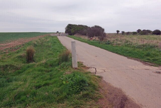 Road to Monkwith, Roos, East Riding of Yorkshire, England. The title is inaccurate: neither Monkwith nor the road to it exists any more - victims of the age-old process of coastal erosion. Just ahead of this point there is a road block and a few yards beyond that the road has disappeared over the cliff.