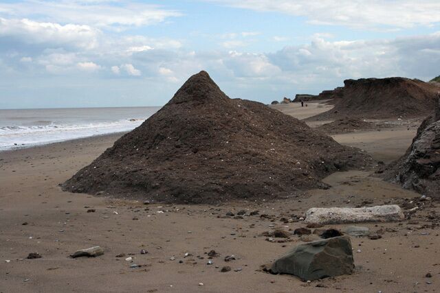A clay mountain, Kilnsea, East Riding of Yorkshire, England. It has a perfect mountain shape, but how long will it last? This is a view looking south-southeast along the beach north of Kilnsea.