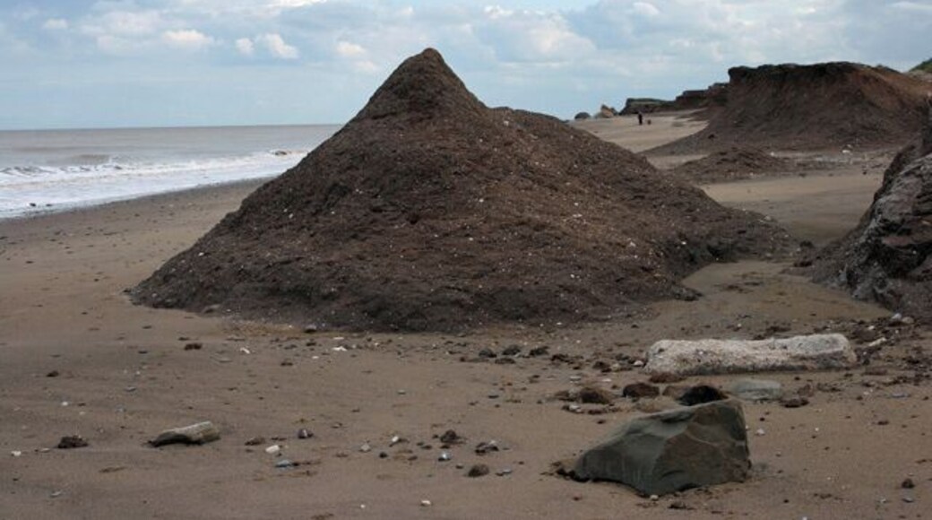 A clay mountain, Kilnsea, East Riding of Yorkshire, England. It has a perfect mountain shape, but how long will it last? This is a view looking south-southeast along the beach north of Kilnsea.