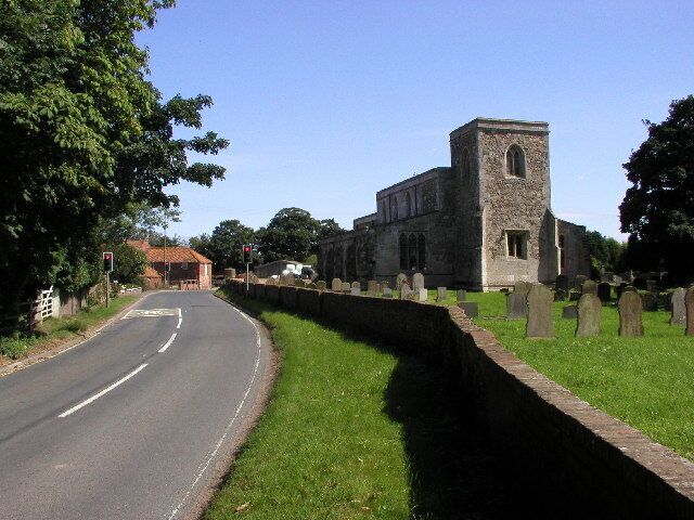 St Mary's, Welwick Village Church, East Riding of Yorkshire. The road here does a sharp 'S' bend around the church and traffic is governed by traffic lights. Picture taken at MR: TA34082114 looking eastwards.