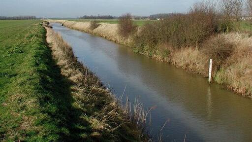 Winestead Drain from North Channel Bridge, Patrington Haven, East Riding of Yorkshire, England. South of Patrington Haven on the parish boundary between Patrington and Sunk Island. Still marked on O/S 1:25000 scale maps as 'North Channel Clough' the clough (a brick sluice with a narrow road bridge above) has been demolished and replaced by a simple concrete and steel structure. This stretch of drain northwest of the bridge is either called North Channel or Winestead Drain depending on who you're talking to at the time.
