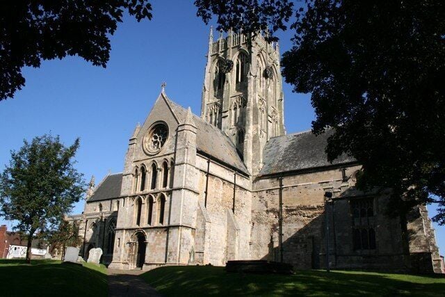 St.Augustine's Church, Hedon, East Riding of Yorkshire, England. The 128ft high Perpendicular tower rises from an Early English church.