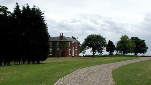 Fitling Grange, Fitling, East Riding of Yorkshire, England. The driveway to Fitling Grange on the south side of Humbleton Road. Fitling Grange was a 227 acre estate in 1874 when it was sold to the Hotham family, built on farmland acquired between 1787 and 1865 by former owners Christopher Kirkby and the Sykes family of Sledmere.