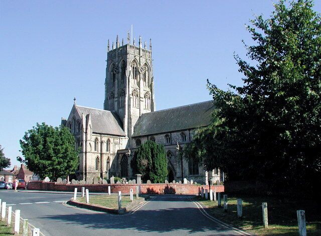St. Augustine's Church, Hedon, East Riding of Yorkshire, England. A charter granted to Hedon by Henry II in 1158 and confirmed in another by King John in the year 1200 meant the residents became Burgesses (or free men) who were allowed to practice their trades freely and buy and sell property within the Borough, whereas the men, women and children living outside the Borough were still under the severe feudal laws of the Lords of the Manor. The Burgesses of Hedon decided to build a substantial and lasting memorial in thanksgiving for their new found prosperity. The building of the present church of St. Augustine was commenced in 1190 on the site of a smaller church on Market Hill. Still standing today, the church dominates the landscape in this area and became known as the "King of Holderness" [information provided by Hedon Town Council]. The "Queen of Holderness" can be found at TA3122 : St. Patrick's Church, Patrington.