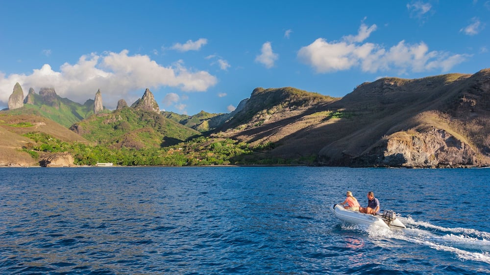 approaching Ua Pou Island from sea, Marquesas Archipelago, French Polynesia, spectacular landscape with extremely steep mountains