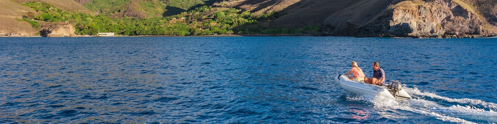 approaching Ua Pou Island from sea, Marquesas Archipelago, French Polynesia, spectacular landscape with extremely steep mountains