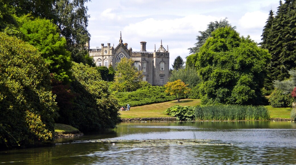 Sheffield Park House and Gardens. Sheffield Park Garden is an informal landscape garden five miles east of Haywards Heath, in East Sussex, England. It was originally laid out in the 18th century by Capability Brown, and further developed in the early years of the 20th century by its then owner, Arthur Gilstrap Soames. It is now owned by the National Trust. The house is not open to the public. A view very similar to this can be seen briefly in the Rosemary & Thyme episode "The Language of Flowers".