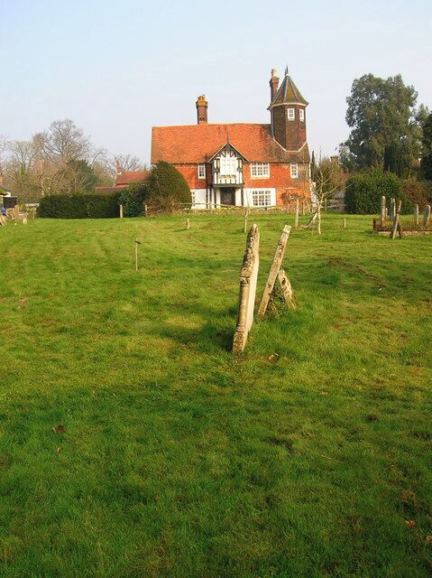 Framfield Church Graveyard Looking back towards the village. I confess to not knowing the name of the building and would appreciate anyone giving me some info about it.