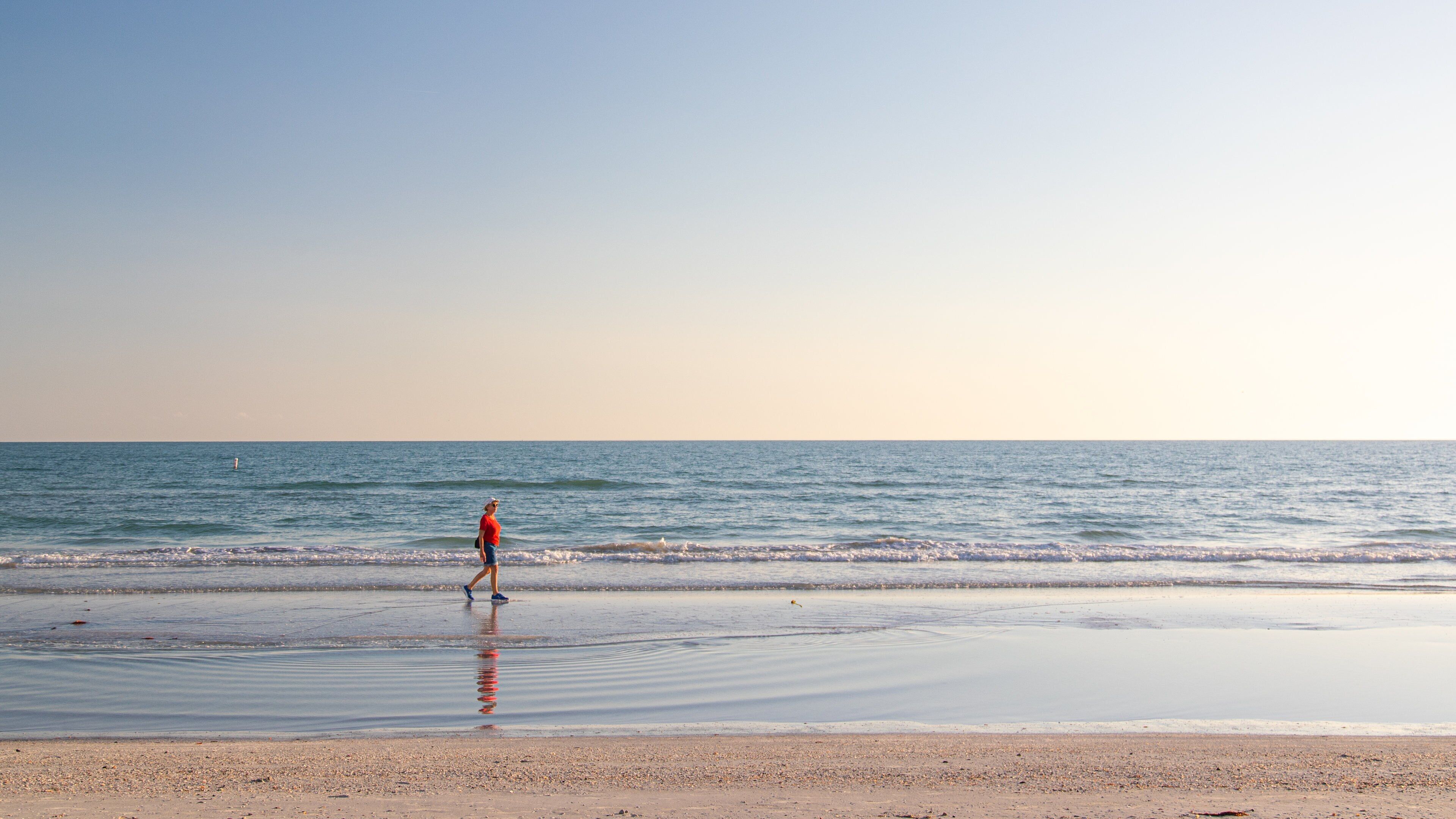 Redington Beach showing a sandy beach, a sunset and general coastal views