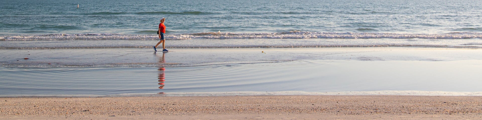 Redington Beach showing a sandy beach, a sunset and general coastal views