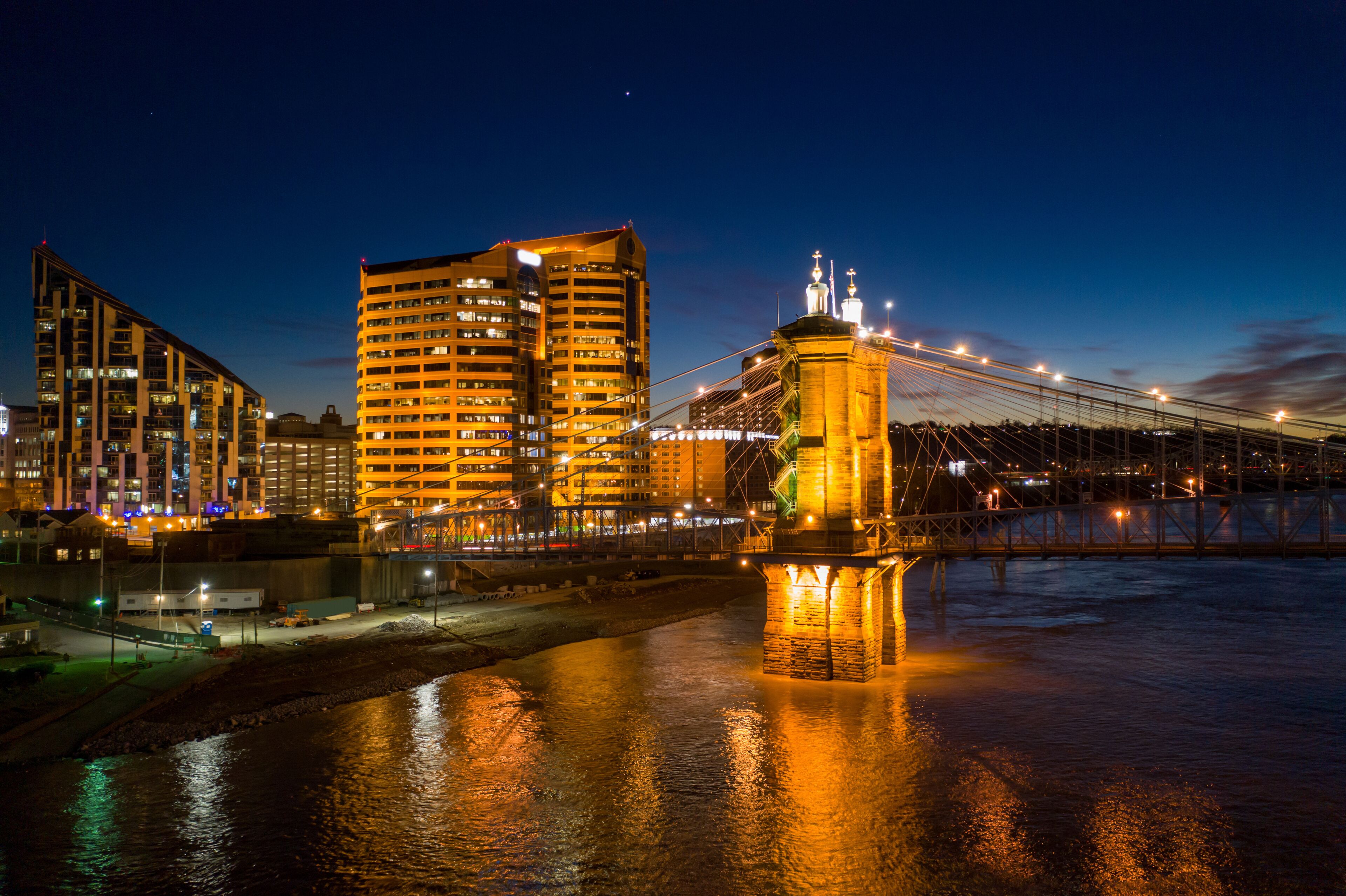 Aerial night photo bridge lit with starry sky John Roebling