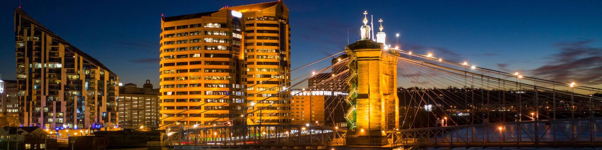 Aerial night photo bridge lit with starry sky John Roebling