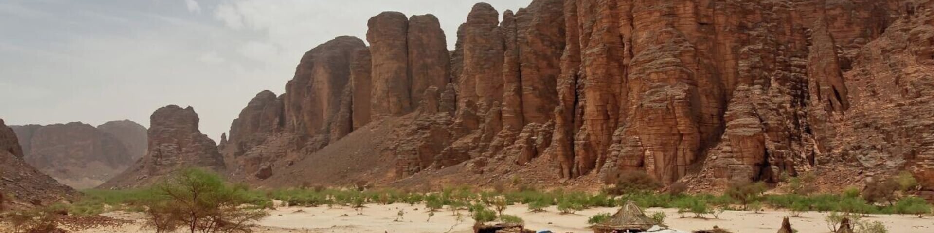 May 2011
Essendilene Canyon, near Djanet, Algeria
In the Saharan dessert in southeast of Algeria there is the Tassili n'Ajer plateau and in one place it has eroded to spikelike sandstone cliffs of a wonderful Essendilene Canyon. This is the dwelling of the local park ranger at the entrance to the canyon.
#unesco