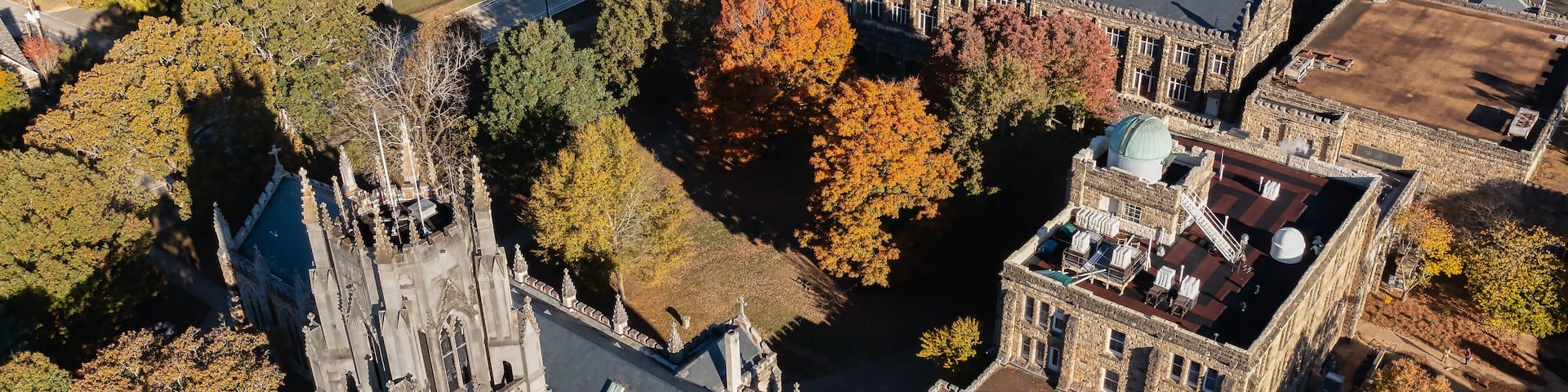 Aerial rear view of the tower, chapel and the Observatory on a mountain top October autumn fall day at the University of the South in Sewanee Tennessee.