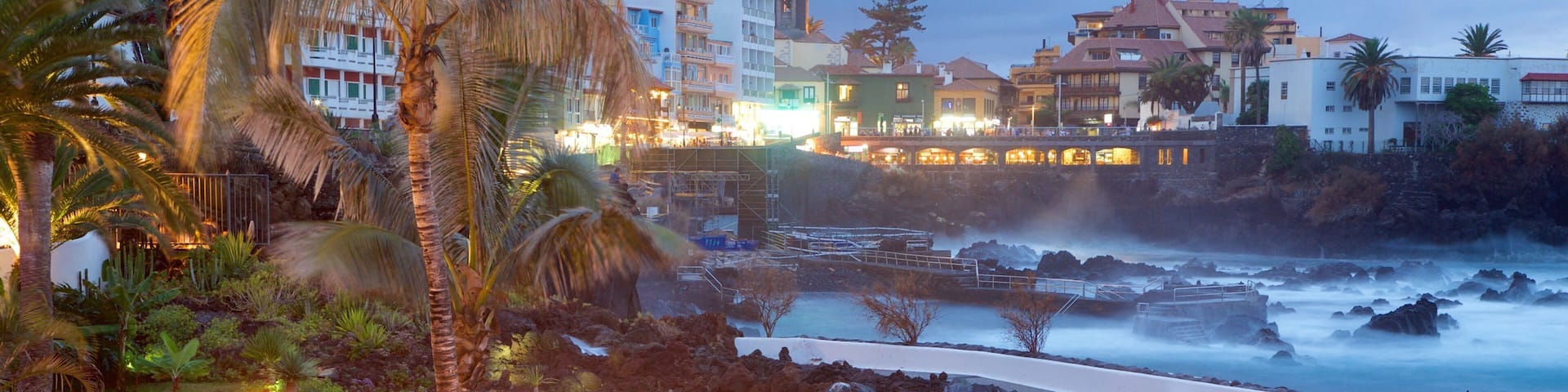 Puerto de la Cruz which includes a luxury hotel or resort, a pool and a coastal town