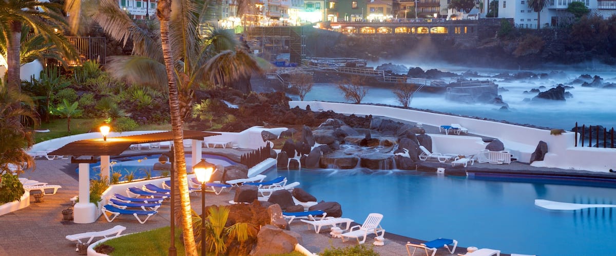 Puerto de la Cruz featuring a luxury hotel or resort, a pool and night scenes