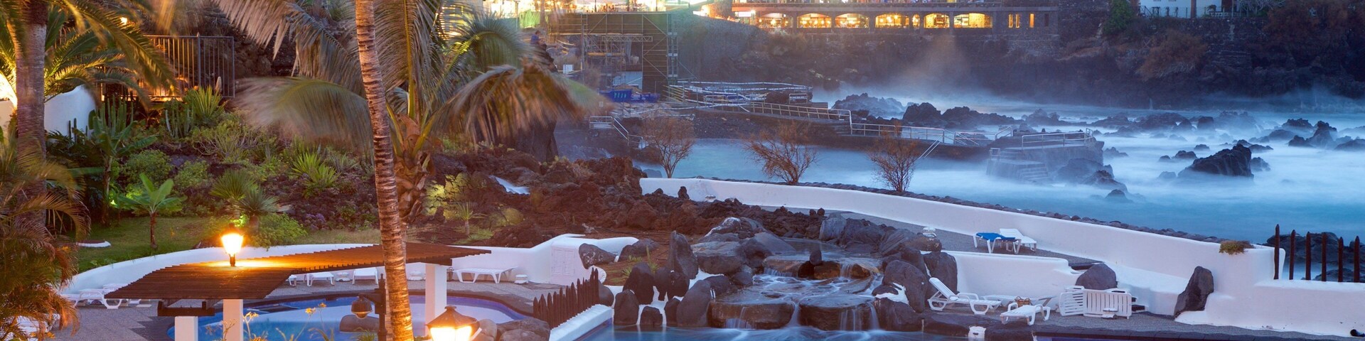 Puerto de la Cruz which includes a luxury hotel or resort, a pool and a coastal town