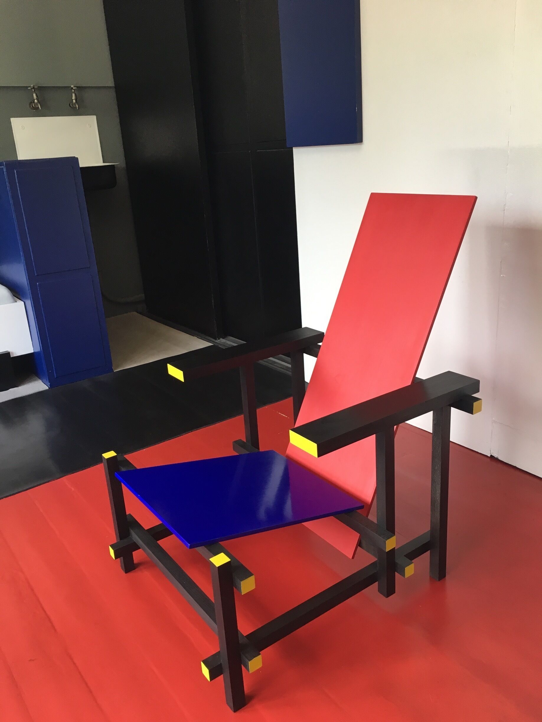 This #red, black blue and yellow chair designed by Architect Gerrit Rietveld can be seen at his house in Utrecht . Schroderhaus.