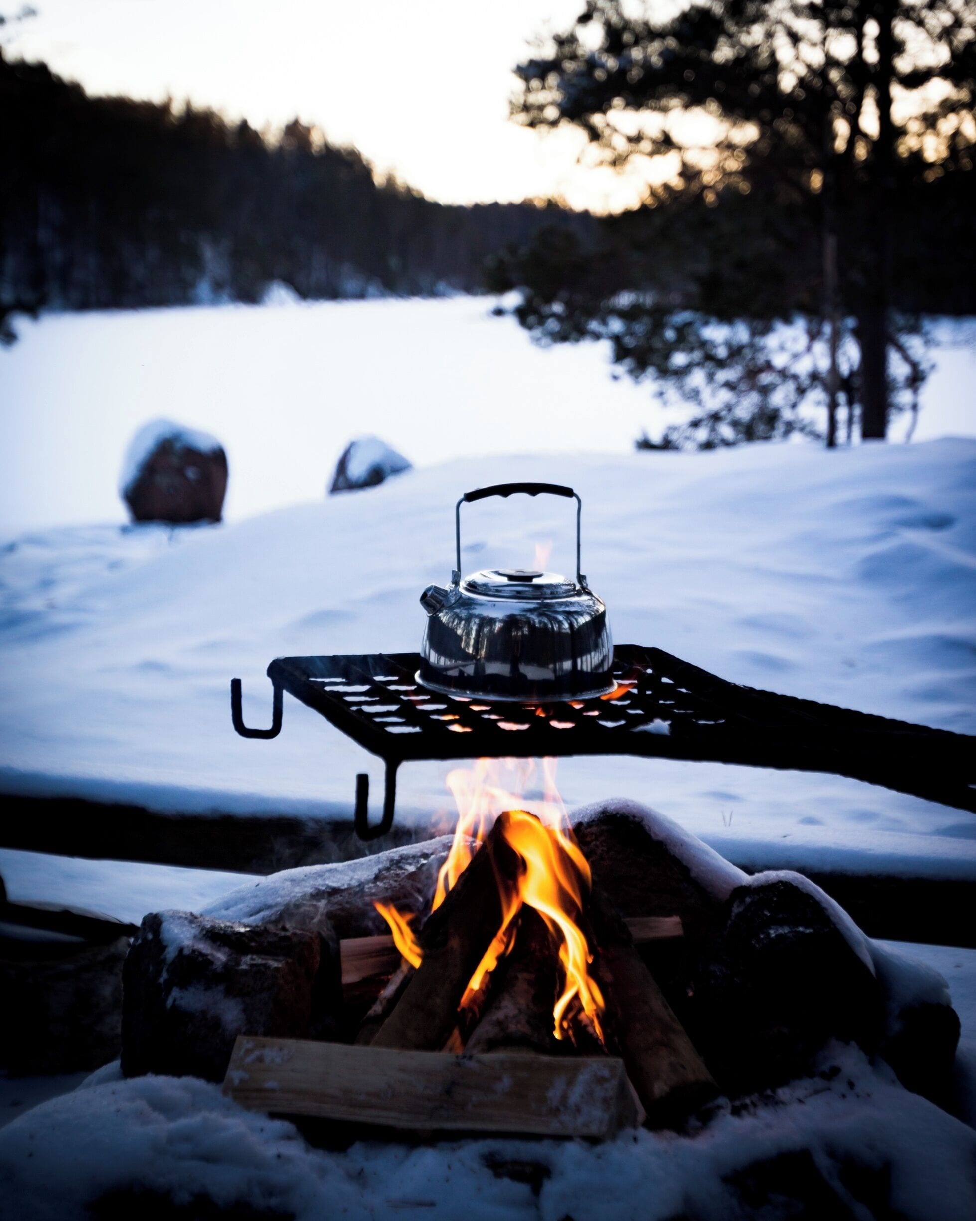 Making a cup of coffee on the fire after a day hike.