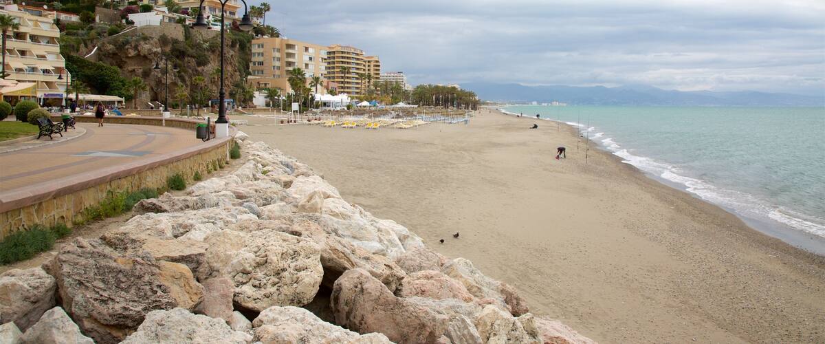 Torremolinos showing a beach and a coastal town