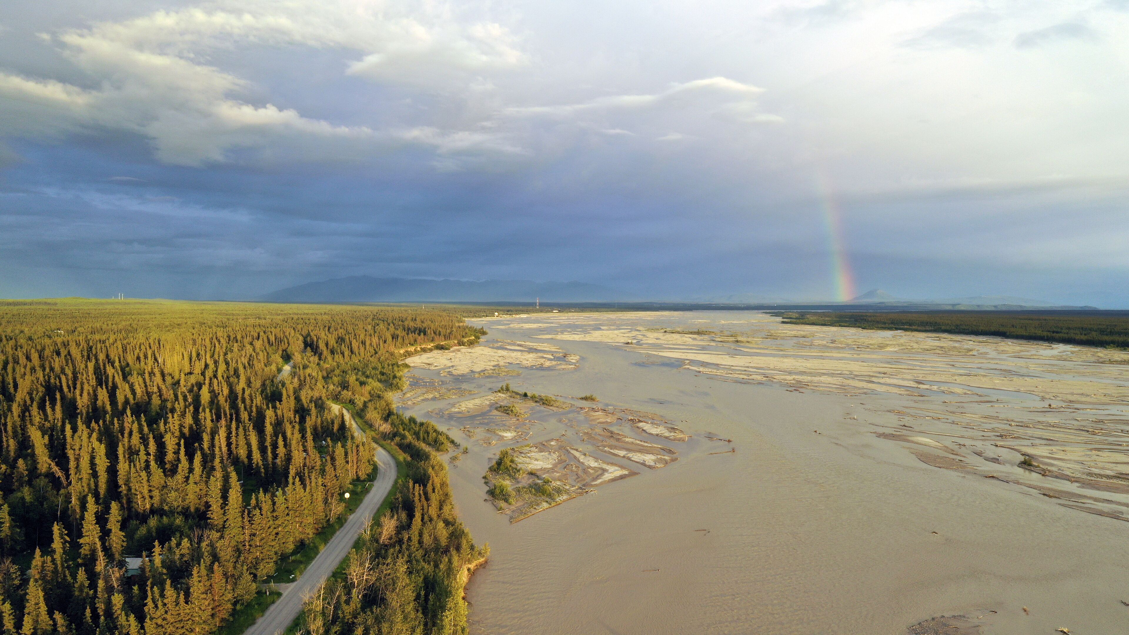 The Delta River makes it's way south from Fairbanks Alaska as a Rainbow Appears