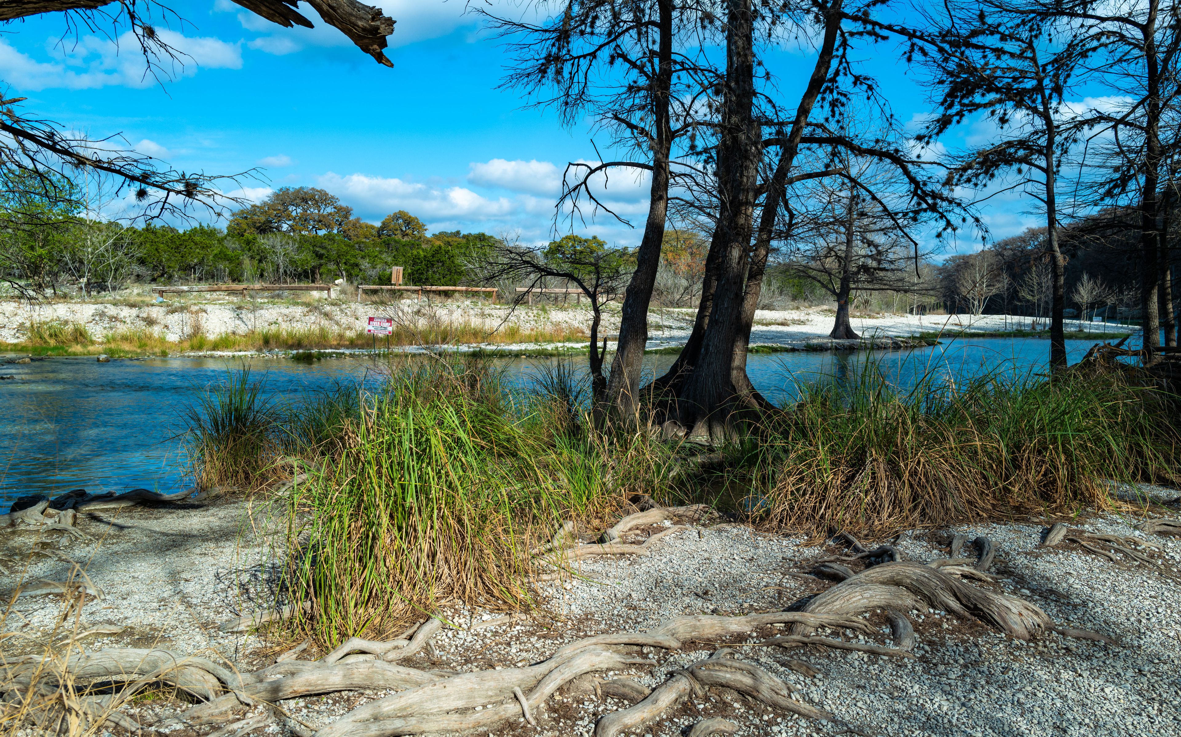 Frio River winding through scenic view of Hill Country terrain in Garner State Park