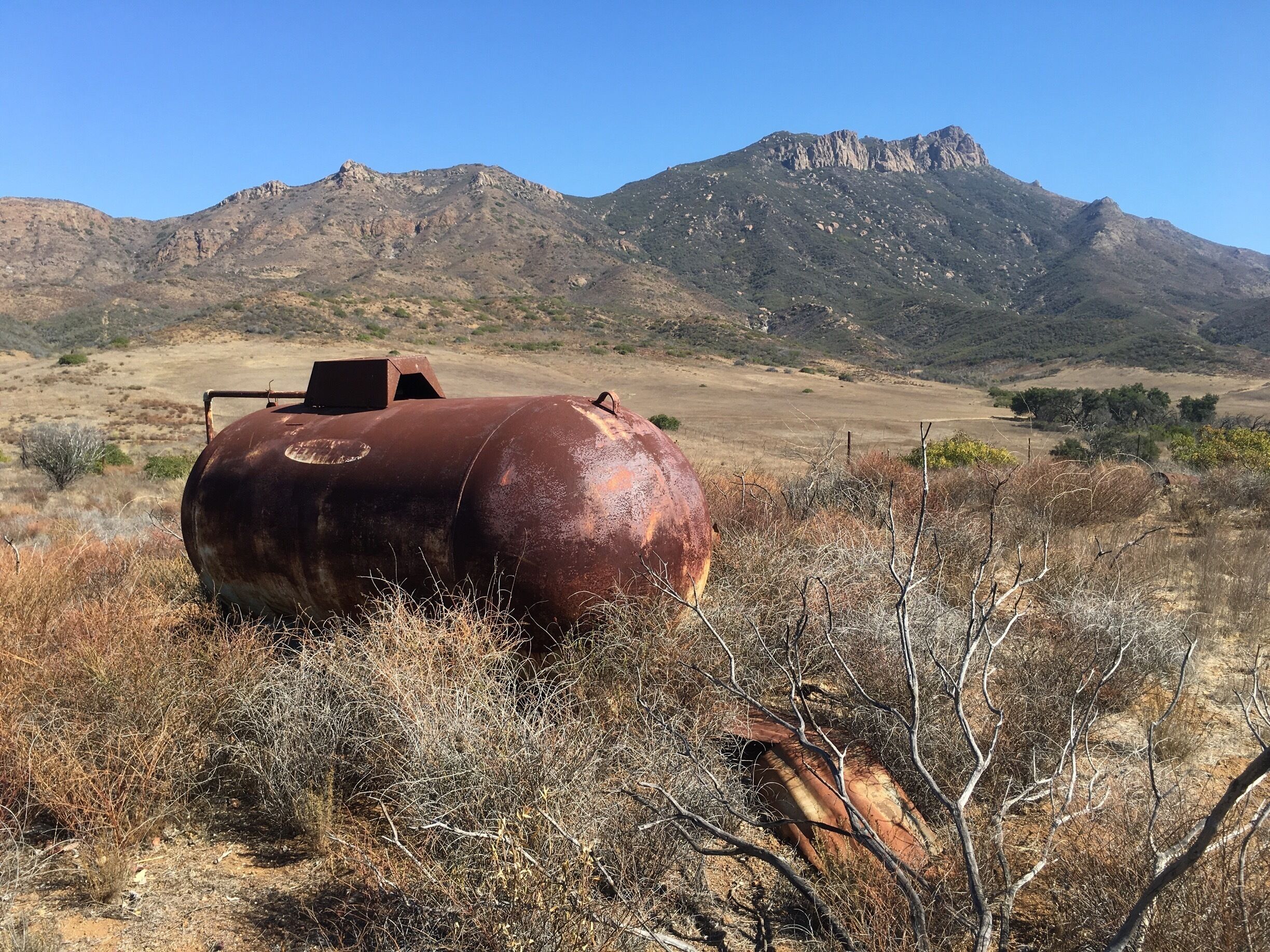 Thousands of years ago Chumash Indians once occupied this land. Boney Mountains, seen in the background, was considered a sacred place to them. Abandoned farm equipment and household items now litter the grasslands of Serrano Homestead site located in Serrano Valley in Point Mugu State Park, the westernmost park of the Santa Monica Mountains.