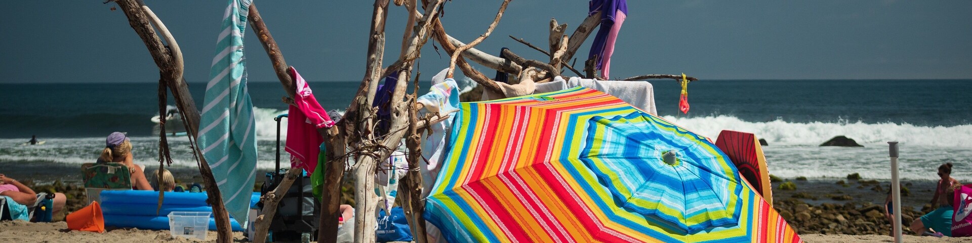 Beachfront Property. With a little driftwood and an umbrella you can be living in seaside luxury. This lean-to was the first thing that caught my eye when I stepped on the sand. If you look deeper, you will discover a grab bag of beach goodies in this shot. #trovember #malibu #beach #california