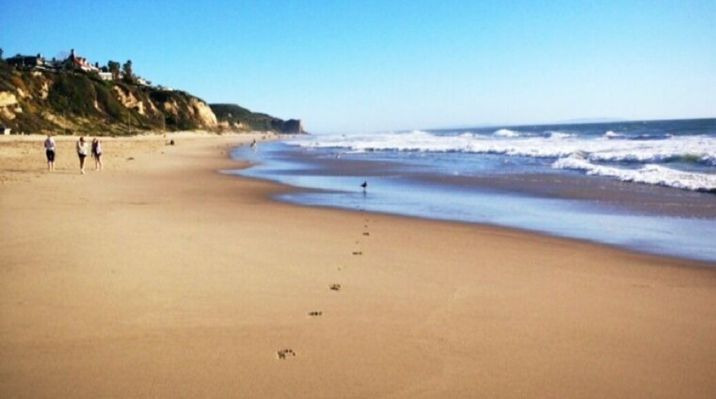 Great place to enjoy some sun, play in the ocean, contemplate the buildings on the edge of the cliff that will collapse someday, and catch a sunset.