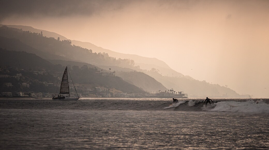 Surfboards and sailboats share the sea as the sun slips above the slopes along Malibu. #adventure #adventure photo contest #surfing #malibu #california #surf spots