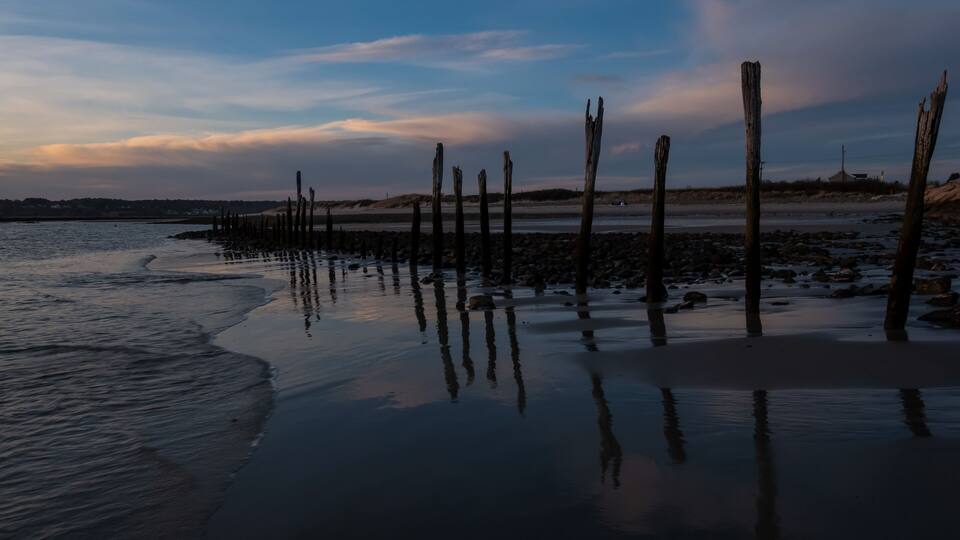 Sunset at low tide on Drakes Island looking into Wells Harbor - Wells, Maine.