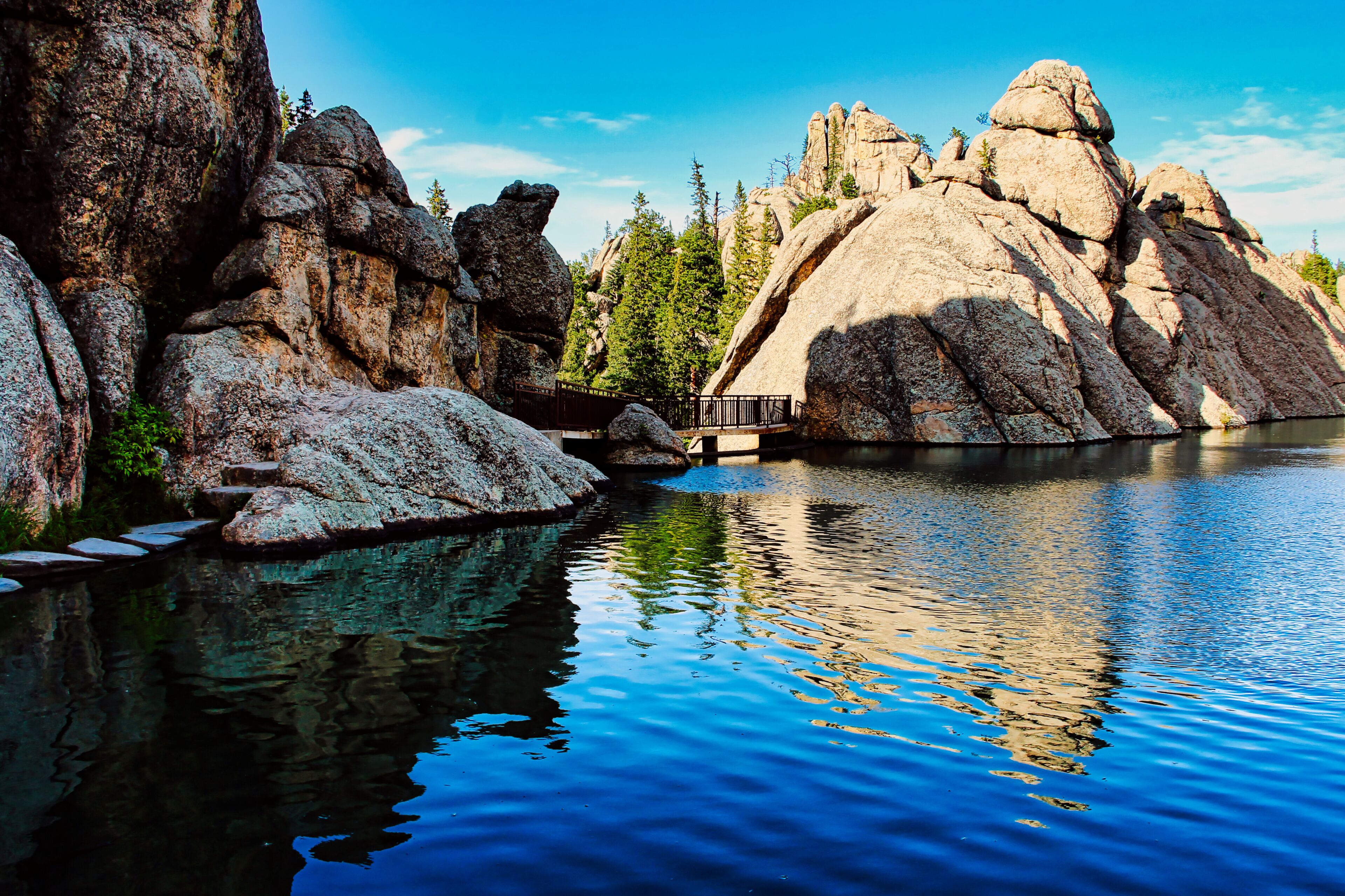 Late Afternoon Shadows on the Footbridge over the Dam on Sylvan Lake in Custer State Park in the Black Hills of South Dakota.