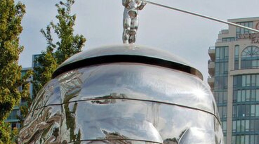 This art work was called "Miss Mao Trying to Poise Herself at the Top of Lenin’s Head" created by Gao Brothers. It was on display in Richmond during Vancouver biennale celebrations.