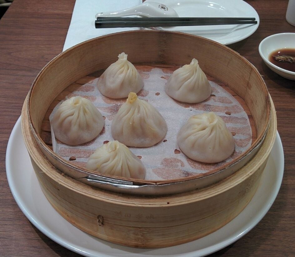 The best Shanghai soup dumplings (xiao long bao) I've had on the west coast was at Dinesty in Richmond, BC. Very soupy underneath. Comparable to Joe's Shanghai in New York. Better than Din Tai Fung in Bellevue, WA.