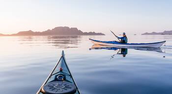 Woman sea kayaking in Bahia de Loreto National Park, Puerto Escondido, Baja California Sur, Mexico