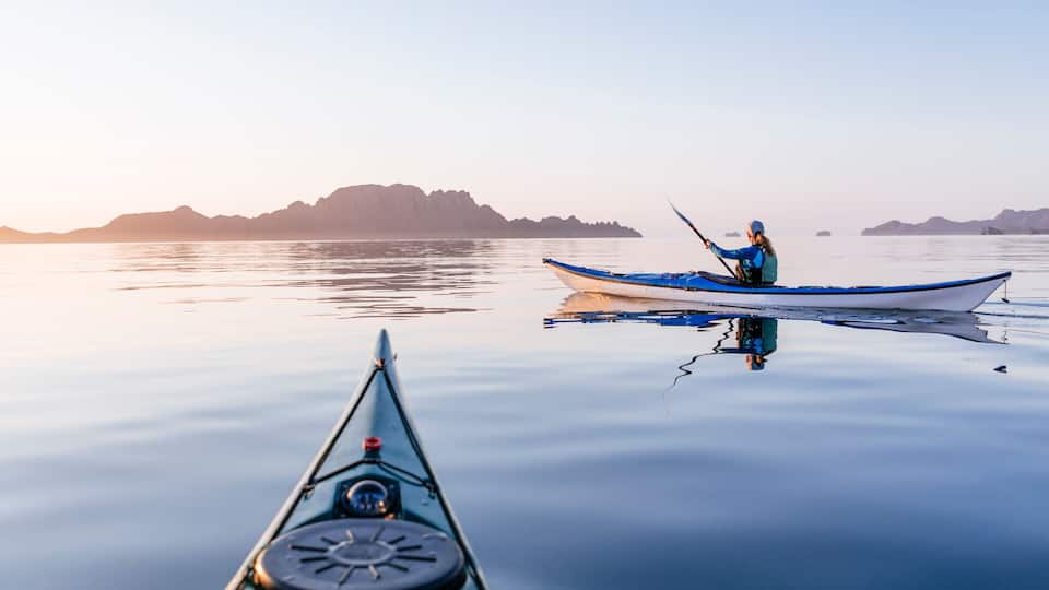 Woman sea kayaking in Bahia de Loreto National Park, Puerto Escondido, Baja California Sur, Mexico