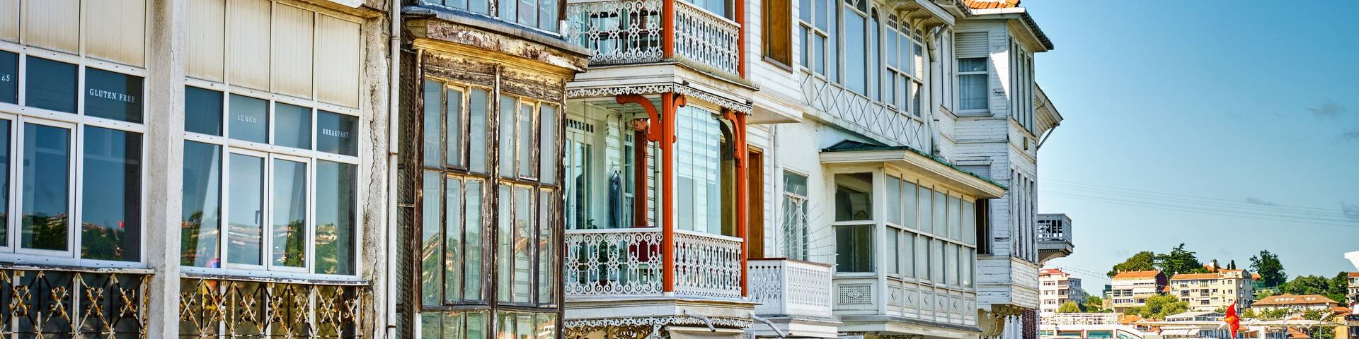 A historic building with ornate balconies and large windows.