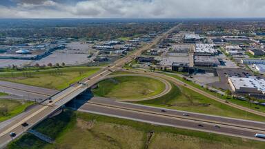 Aerial view of highway interchange with traffic on a bridge and streets roads and lanes crossroads cars near Fairview Heights Illinois USA