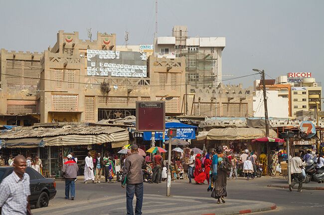 Sandanga lies roughly midway on Plateau center in Dakar and is the biggest of Dakar`s markets. If you are not familiar with African markets is worth a visit, but be careful with your valuables and do not be fooled to follow strangers. Sandanga is a mix of flea market and tourist market. It is fussy and chaotic and sellers are ongoing. Try to visit Sandanga early in the morning. It is less crowded at that time of day and fruits and vegetables are fresh and look attractive.
Read more: http://www.travelwithallsenses.com/shopping-dakars-markets/