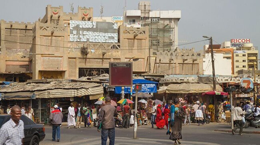 Sandanga lies roughly midway on Plateau center in Dakar and is the biggest of Dakar`s markets. If you are not familiar with African markets is worth a visit, but be careful with your valuables and do not be fooled to follow strangers. Sandanga is a mix of flea market and tourist market. It is fussy and chaotic and sellers are ongoing. Try to visit Sandanga early in the morning. It is less crowded at that time of day and fruits and vegetables are fresh and look attractive.
Read more: http://www.travelwithallsenses.com/shopping-dakars-markets/