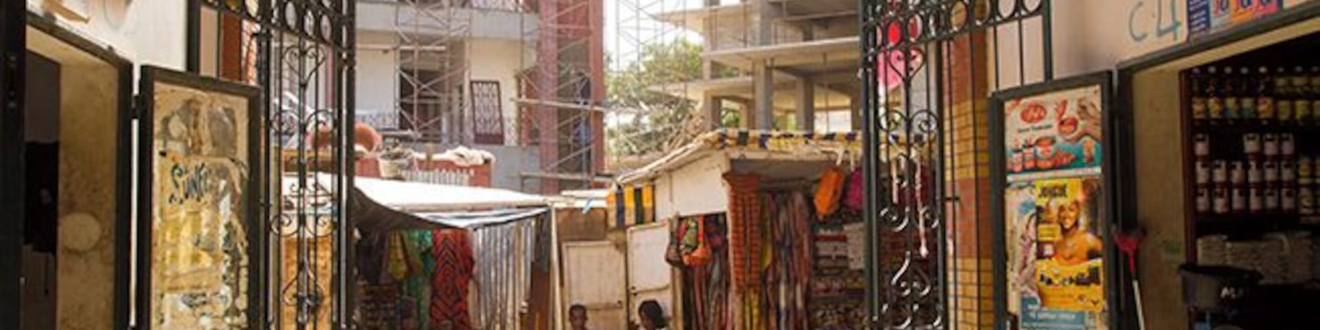 This is a must visit, one of the best of Dakar`s markets! In a beautiful circular building the fish traders has their place in the center. Then comes butchers in the next circle, vegetable and fruit dealers outside there together with florists. Outside the building you will find typical African souvenirs such as jewelry, masks and sculptures. 
Read more: http://www.travelwithallsenses.com/shopping-dakars-markets/