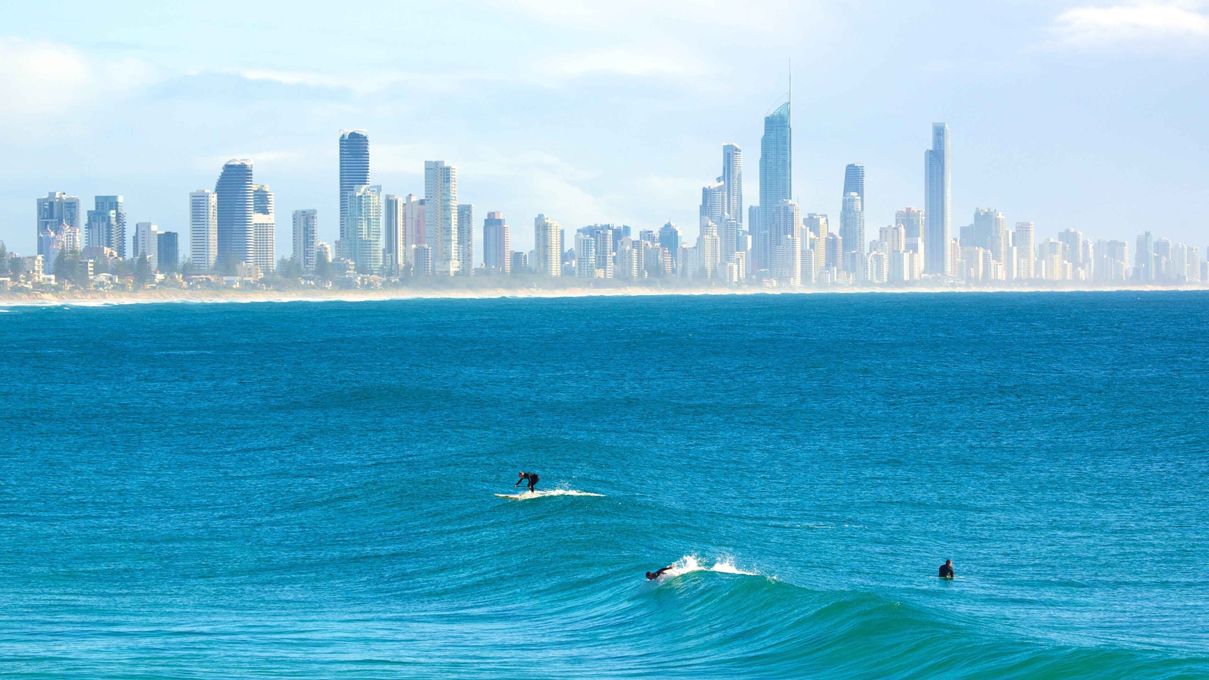 Burleigh Heads which includes skyline, general coastal views and surfing