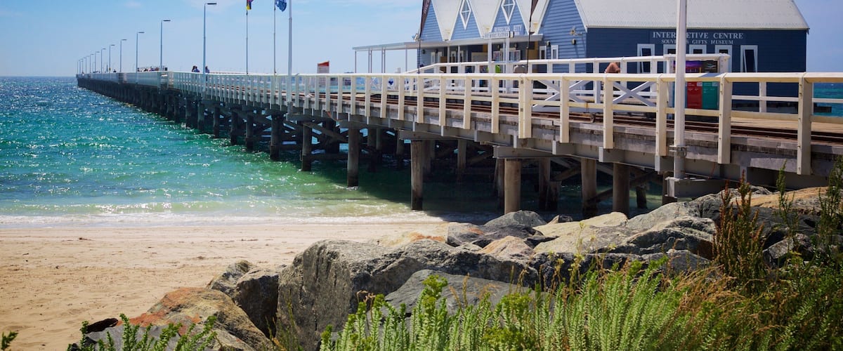 A pier extending into the ocean with a building labeled "INTERACTIVE CENTRE" at the end.