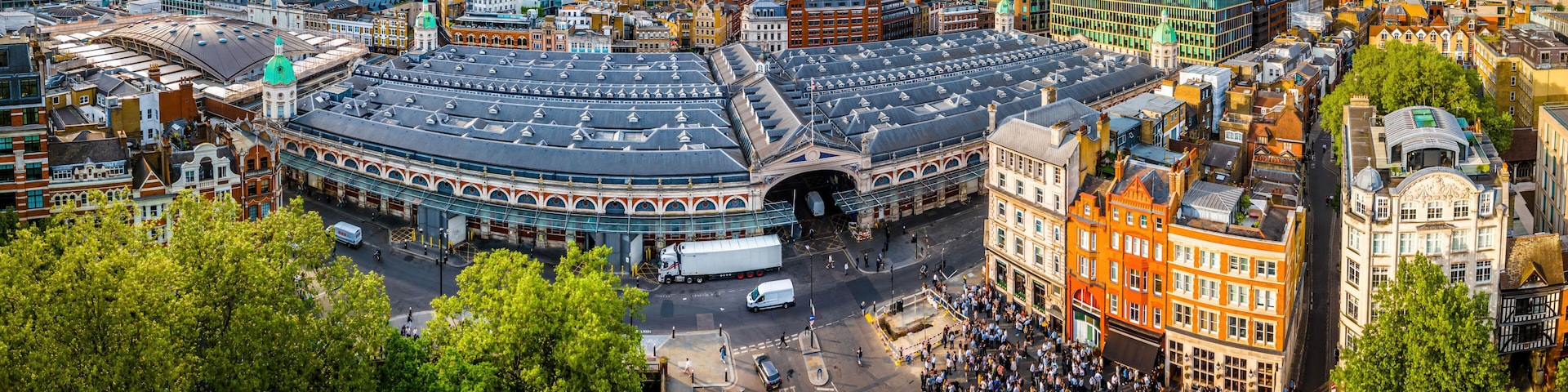 Aerial view of Smithfield Market in London, featuring historic architecture, city streets, and surrounding modern urban buildings