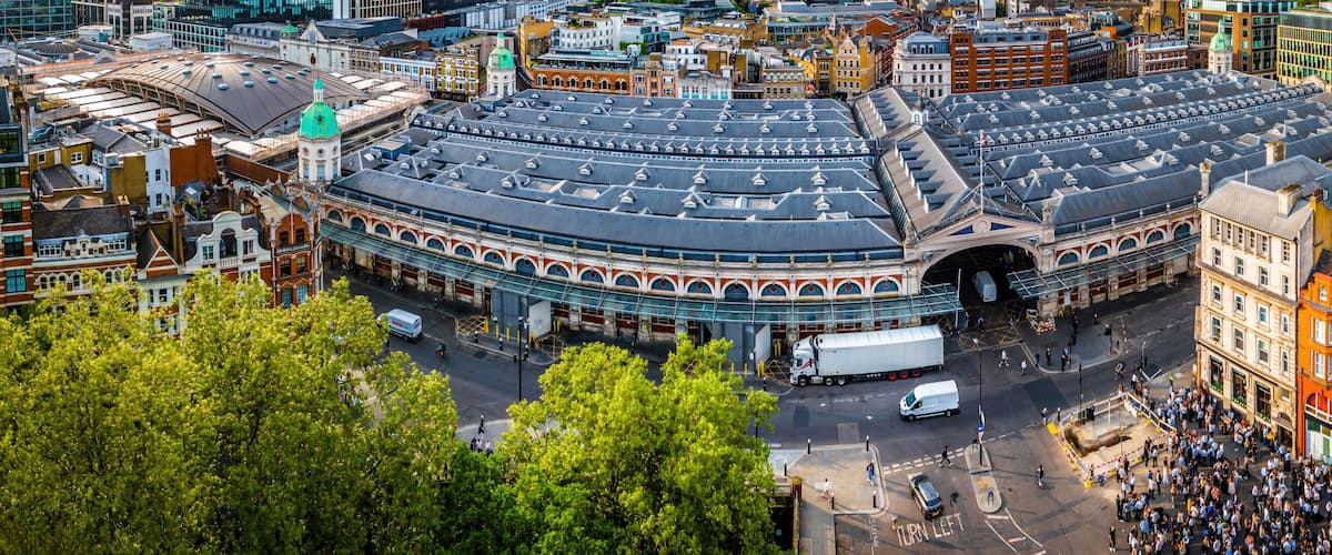A historic round building with a dome, surrounded by a mix of traditional and modern architecture.