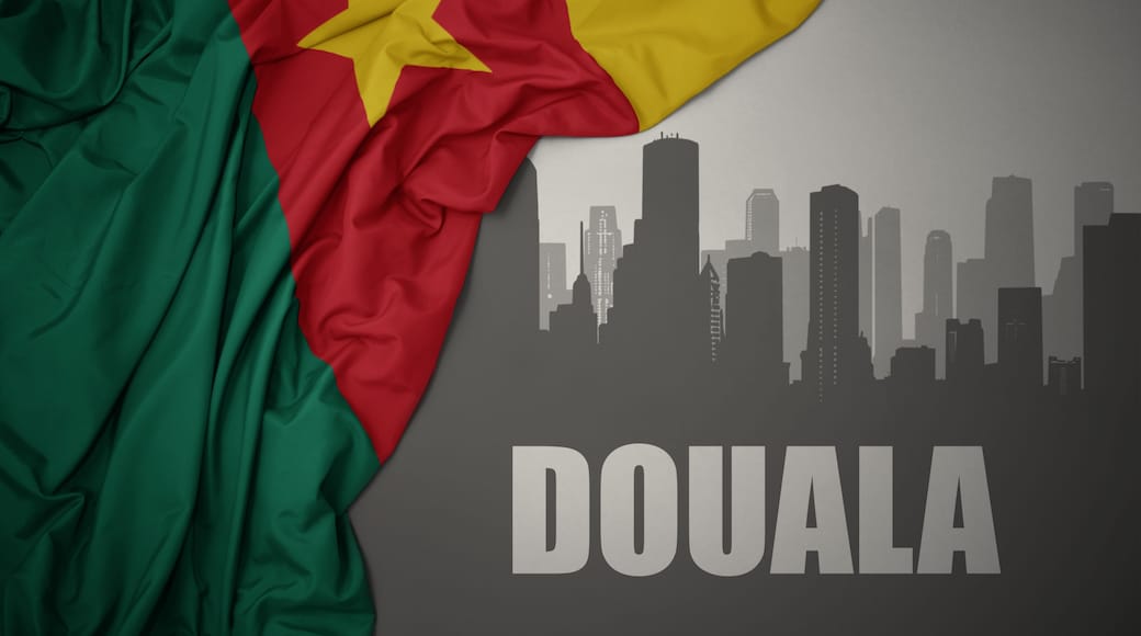 The flag of Senegal draped over a city skyline silhouette with the word 'DOUALA' at the bottom.