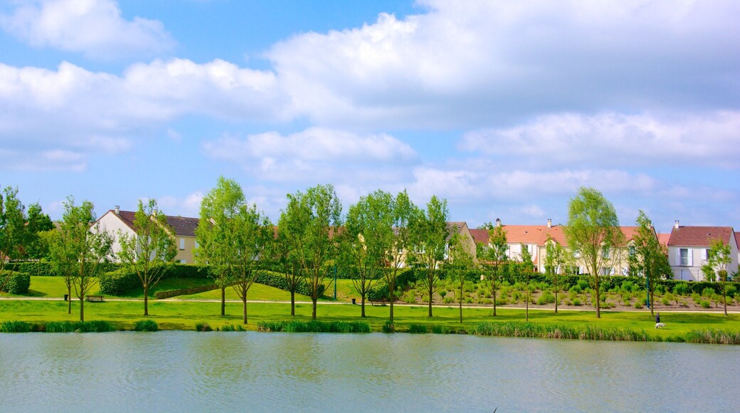 Marne-la-Vallee featuring a river or creek and a garden