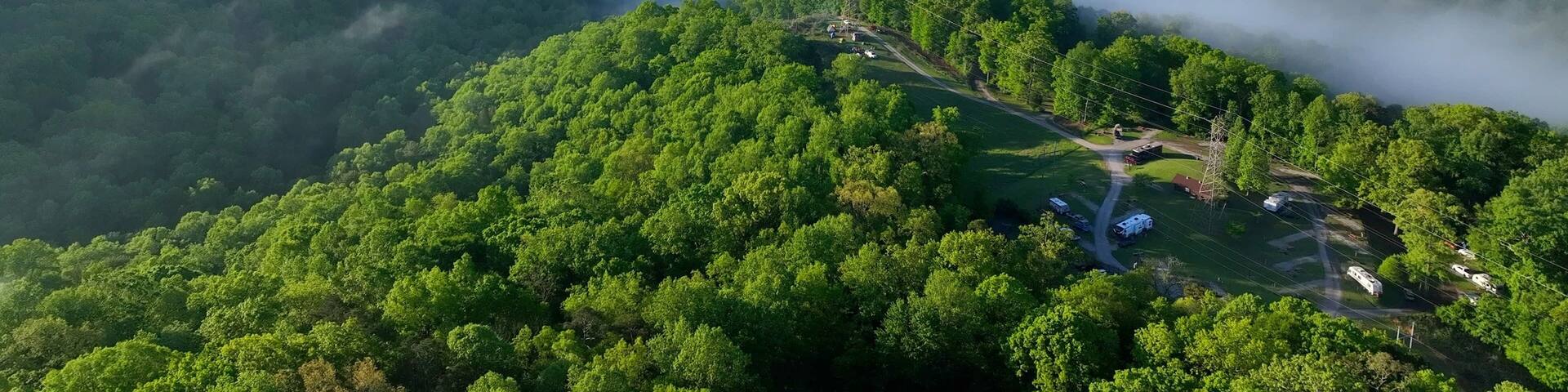 Camping in Tennessee green mountains at Norris Dam near Rocky top with morning misty clouds and sunlight