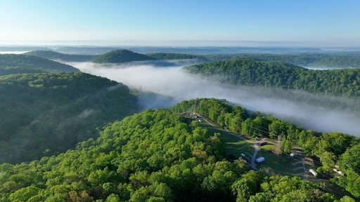 Camping in Tennessee green mountains at Norris Dam near Rocky top with morning misty clouds and sunlight